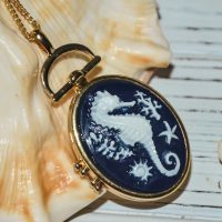 Seahorse locket necklace golden tone, Blue and white necklace
